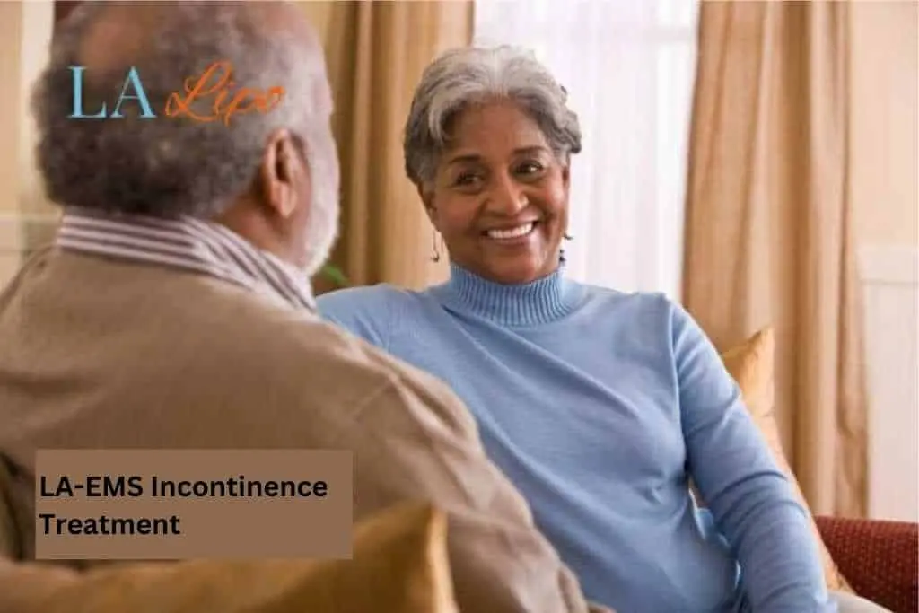 Couple sat smiling at each other - LA-EMS treatment Wigan