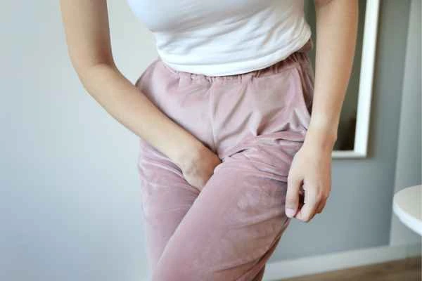 woman running for the toilet because of urinary incontinence Wigan